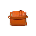 Stylish orange leather handbag for girls by LeatherLuxe – premium shoulder bag with elegant design and fine craftsmanship.