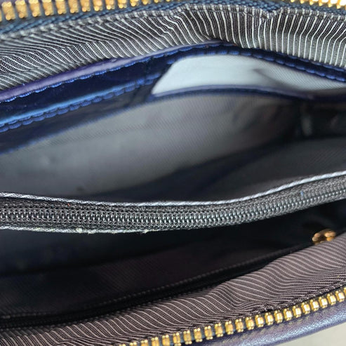 LeatherLuxe navy blue leather clutch bag and shoulder crossbody handbag for women – elegant, premium genuine leather design with adjustable strap and gold accents.