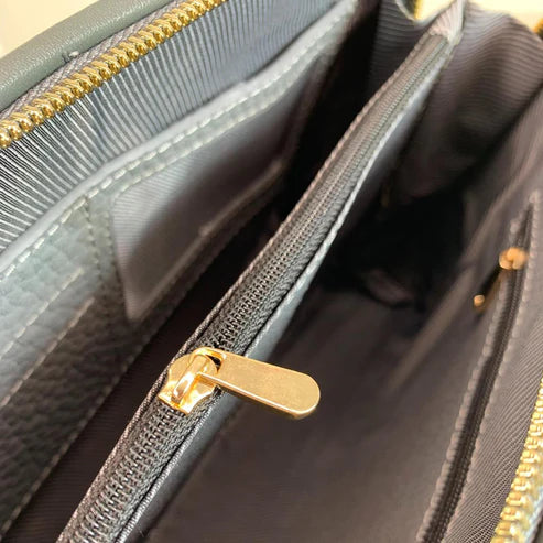 LeatherLuxe silver leather clutch and crossbody bag with detachable shoulder strap, elegant metallic finish, and minimalist luxury design for evening and casual wear.