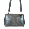LeatherLuxe silver leather clutch and crossbody bag with detachable shoulder strap, elegant metallic finish, and minimalist luxury design for evening and casual wear.