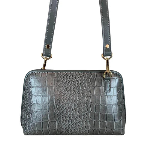LeatherLuxe silver leather clutch and crossbody bag with detachable shoulder strap, elegant metallic finish, and minimalist luxury design for evening and casual wear.