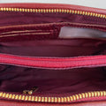 Elegant dark red genuine leather clutch bag with shoulder strap and crossbody design — LeatherLuxe premium women’s handbag