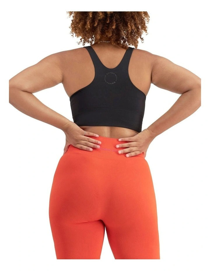 Women's Move Seamless Crop Bra in nylon elastane with high neckline, pullover design, medium support, and moisture-wicking fabric.