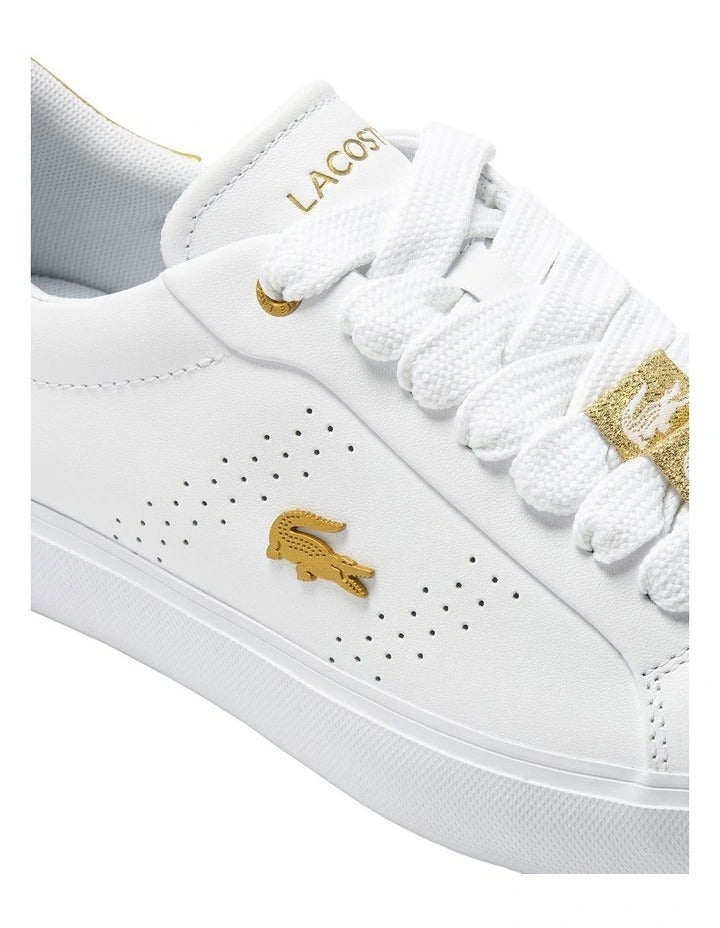 Lacoste Powercourt 2.0 Sneaker in White/Gold, featuring a sleek leather upper with gold accents for a premium, stylish look.