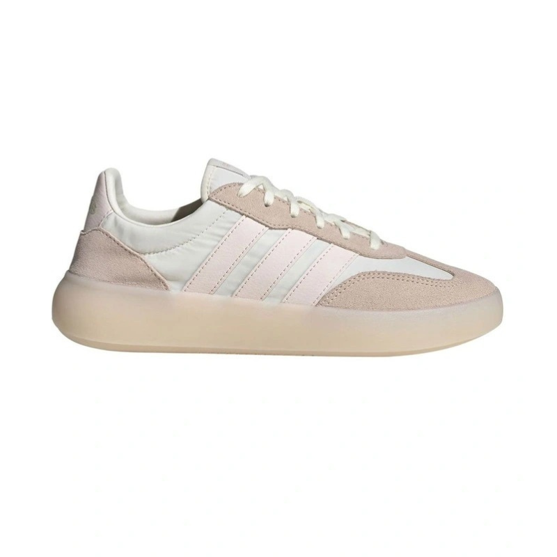 Beige and white sneaker with Adidas logo on a white background