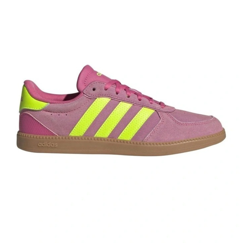 Pink Adidas sneaker with yellow stripes on a white background