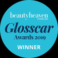 Blue badge with 'beautyheaven.com.au Glossscar Awards 2019 Winner' text