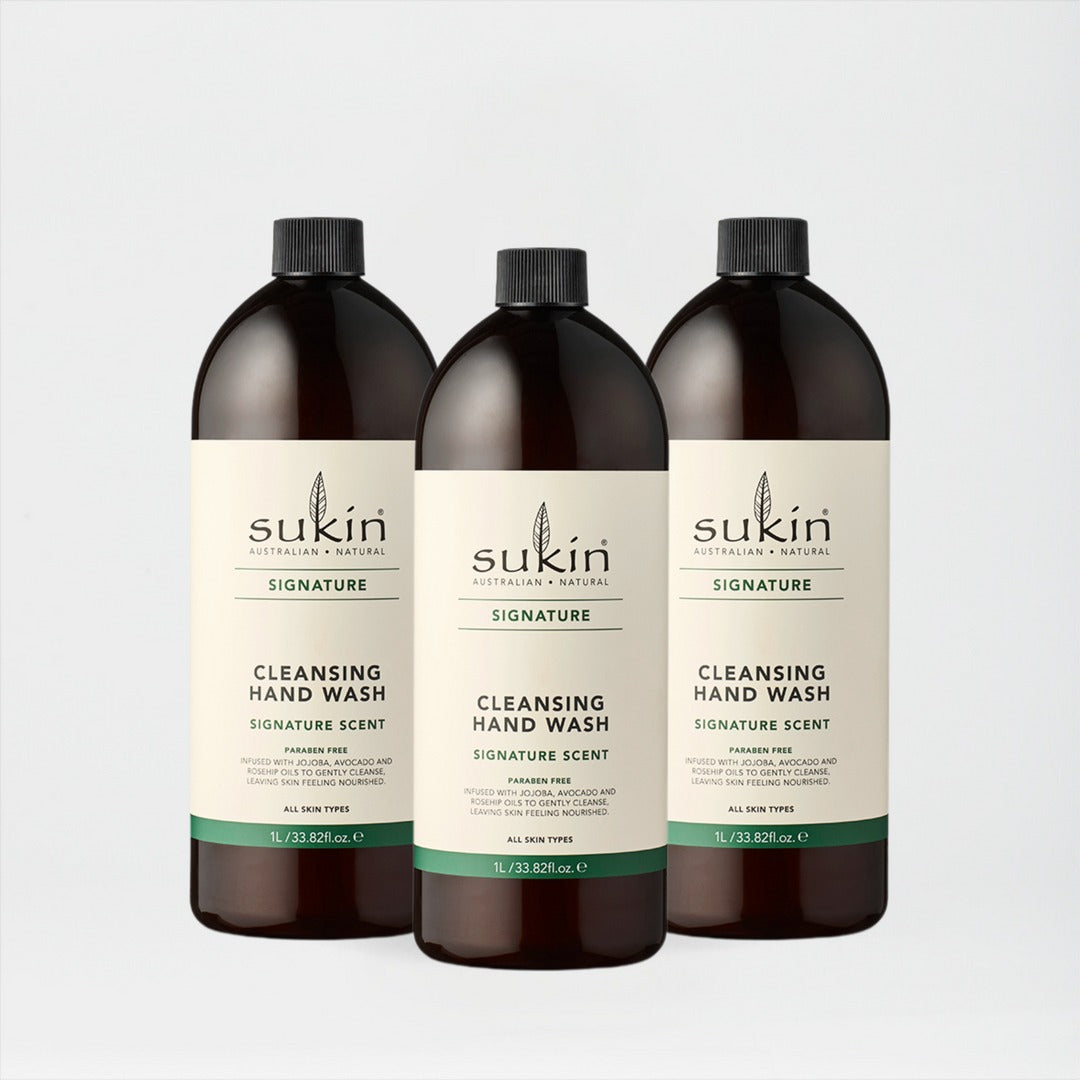 Three bottles of Sukin cleansing hand wash on a light gray background