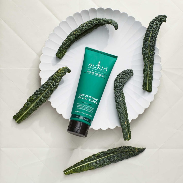 Green tube of Sukin Super Greens Detoxifying Facial Scrub on a white background