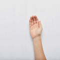 Hand raised on a plain white background