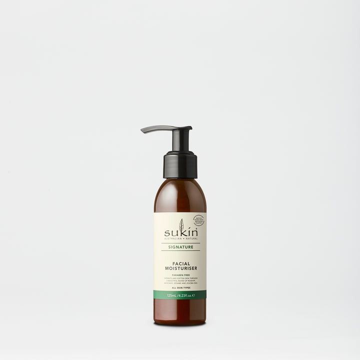 Sukin facial moisturizer bottle on a light gray background
