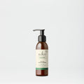 Sukin facial moisturizer bottle on a light gray background