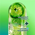 Grapefruit extract with vitamin B6 niacinamide on a green background