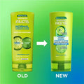 Comparison of an old and new Garnier Fructis conditioner bottle on a gradient green and blue background.