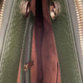 Elegant green leather office bag with detachable shoulder strap, ideal for professionals and business travel.