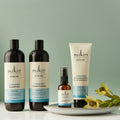 Sukin hair care products on a light green background