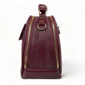 Elegant dark red genuine leather women’s satchel handbag with structured medium design and gold-tone accents — perfect for everyday and office wear.