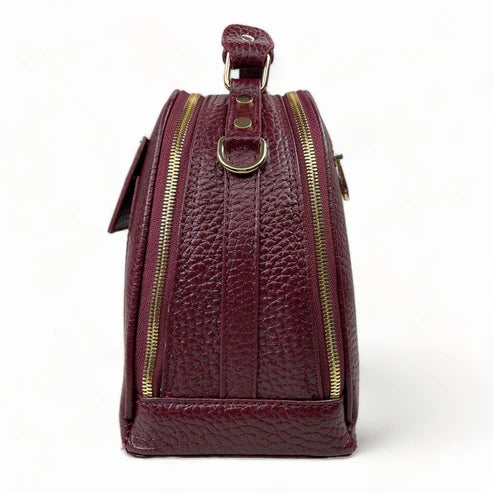 Elegant dark red genuine leather women’s satchel handbag with structured medium design and gold-tone accents — perfect for everyday and office wear.