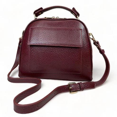 Elegant dark red genuine leather women’s satchel handbag with structured medium design and gold-tone accents — perfect for everyday and office wear.