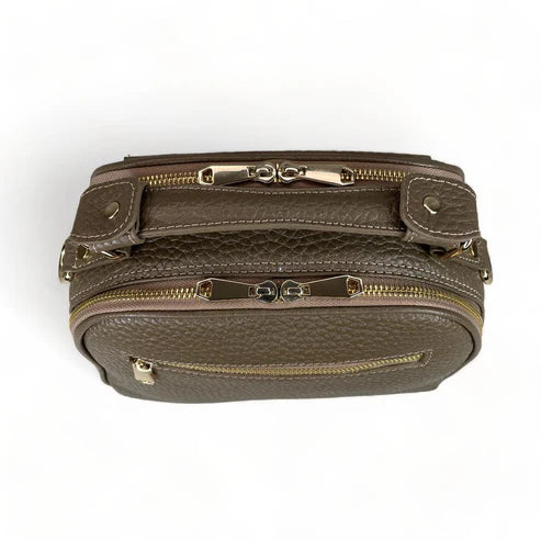 Beige leather women's handbag with shoulder strap — elegant satchel for everyday and formal occasions.
