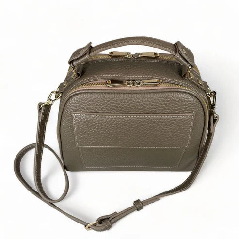 Beige leather women's handbag with shoulder strap — elegant satchel for everyday and formal occasions.