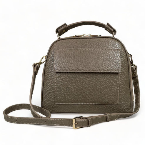 Beige leather women's handbag with shoulder strap — elegant satchel for everyday and formal occasions.