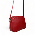 LeatherLuxe red leather women's shoulder bag with adjustable crossbody strap, elegant and stylish design for everyday fashion.