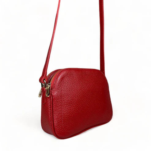LeatherLuxe red leather women's shoulder bag with adjustable crossbody strap, elegant and stylish design for everyday fashion.