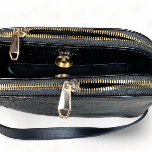 LeatherLuxe black leather women's shoulder bag and crossbody purse with sleek design and gold-tone hardware