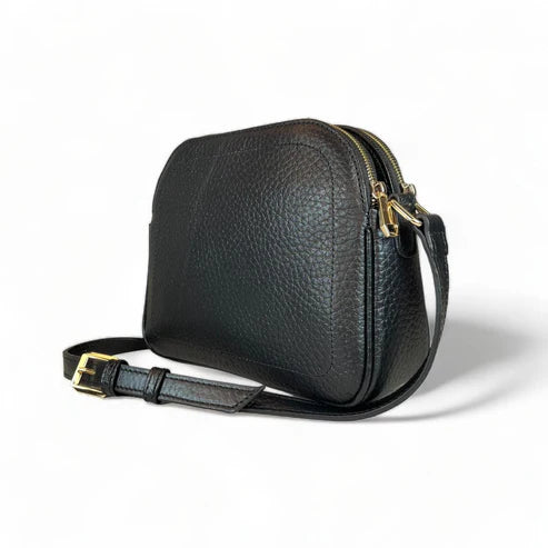 Premium black leather crossbody shoulder bag with adjustable strap, sleek minimalist design, and high-quality stitching for everyday use.