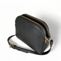 Premium black leather crossbody shoulder bag with adjustable strap, sleek minimalist design, and high-quality stitching for everyday use.