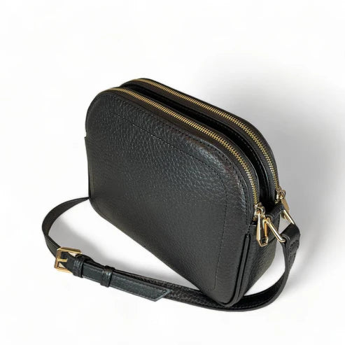 Premium black leather crossbody shoulder bag with adjustable strap, sleek minimalist design, and high-quality stitching for everyday use.