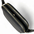 Premium black leather crossbody shoulder bag with adjustable strap, sleek minimalist design, and high-quality stitching for everyday use.