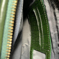 Elegant green crocodile-pattern leather clutch crossbody bag with gold hardware and detachable strap, perfect for evening or casual outings.