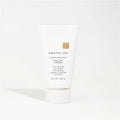 White hair product bottle with 'Kristin Ess' branding on a white background