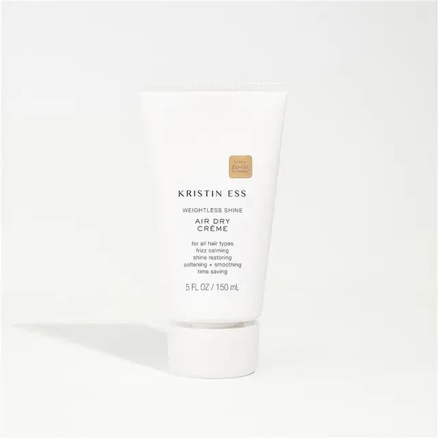 White hair product bottle with 'Kristin Ess' branding on a white background
