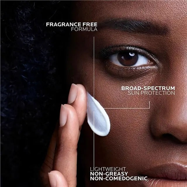 Person applying sunscreen with text highlighting features on a close-up of skin.