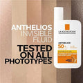 La Roche-Posay Anthelios Invisible Fluid sunscreen bottle with text on a striped background