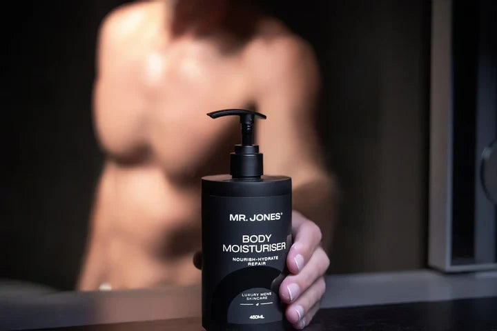 The Body Pack – Men’s Body Care Set including body wash, body lotion, and grooming essentials, arranged neatly on a bathroom counter for men’s skincare