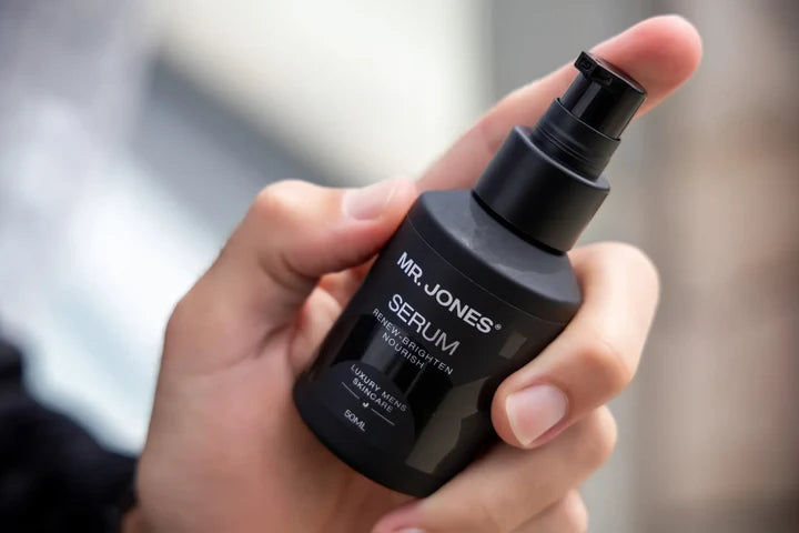 Virtue men’s skincare set with cleanser, exfoliator, moisturizer, face mask, and serum in sleek black packaging displayed with male models