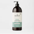Sukin Natural Balance Conditioner bottle on a light gray background