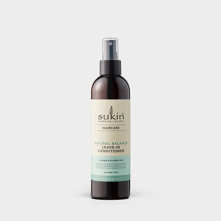 Sukin hair care spray bottle on a white background