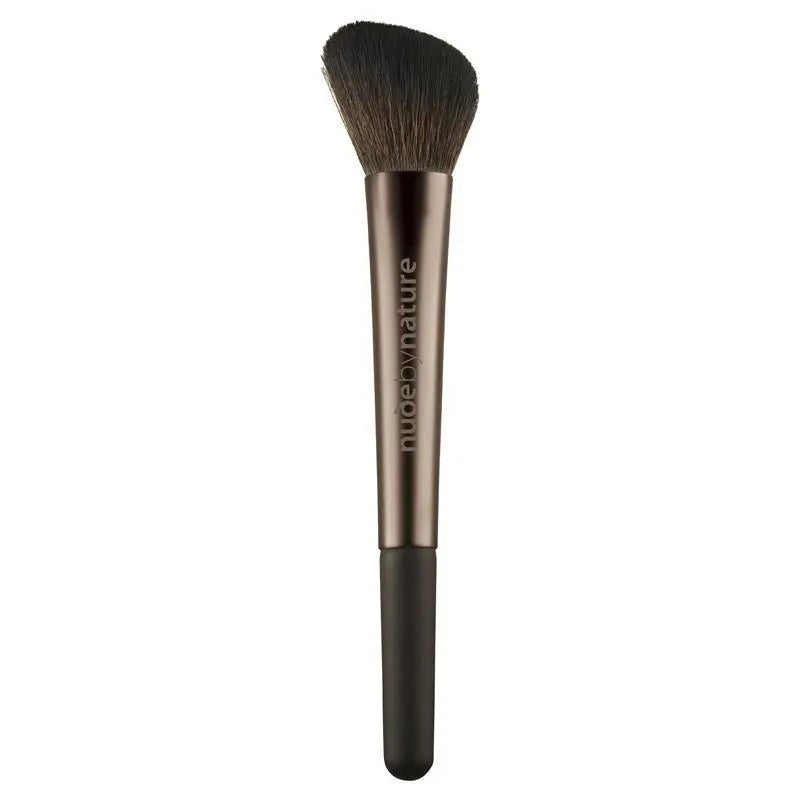 Makeup brush with 'nude by nature' branding on a white background