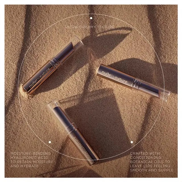 Three lip products on a textured surface with 'nuda natura' branding.