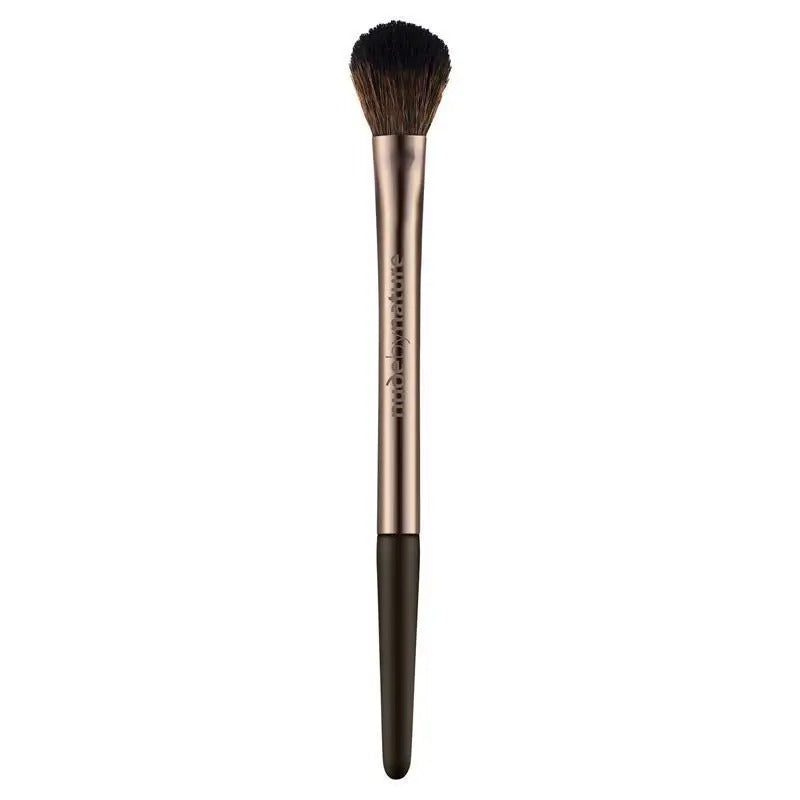 Makeup brush with rose gold handle and black bristles on a white background