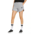 Person wearing gray Puma shorts on a white background