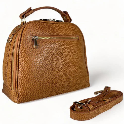 Premium leather women's handbag in satchel and shoulder bag style, featuring elegant stitching, durable handles, and a classic design for everyday and formal use.
