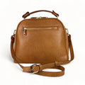 Premium leather women's handbag in satchel and shoulder bag style, featuring elegant stitching, durable handles, and a classic design for everyday and formal use.