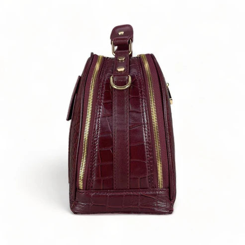 Red leather women's handbag – premium satchel and shoulder bag with elegant stitching, gold-tone hardware, and adjustable strap – luxury fashion accessory for women.