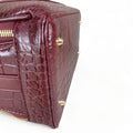 Red leather women's handbag – premium satchel and shoulder bag with elegant stitching, gold-tone hardware, and adjustable strap – luxury fashion accessory for women.